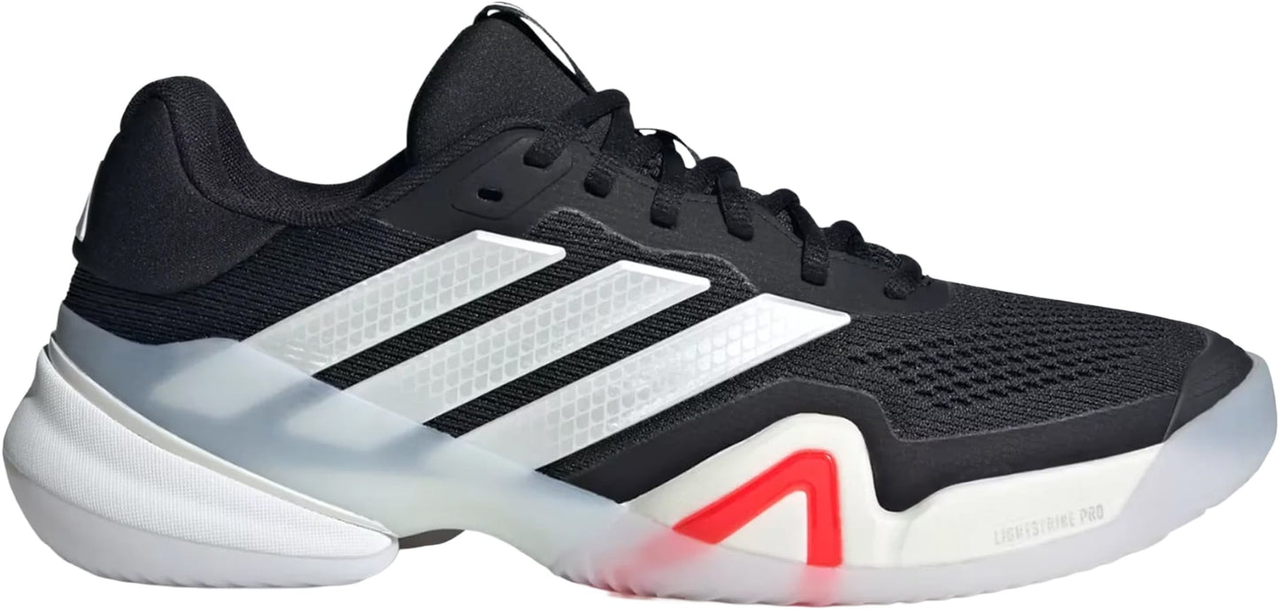 The adidas Barricade 14 Men's Tennis Shoes in black feature white stripes, a white and translucent sole, red midsole accents, and a mesh upper. Their low-cut, lightweight design is perfect for tennis or casual wear.