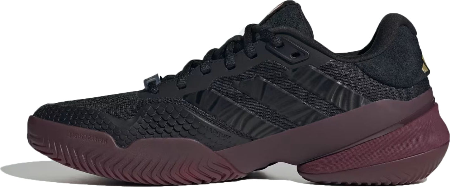 Introducing the adidas Barricade 14 Men’s Tennis Shoes in Core Black/Core Black/Maroon—featuring a sleek black athletic design with textured accents, signature adidas stripes on the side, and a dark maroon sole. Engineered for baseline players, this shoe is shown from the left profile against a white background.