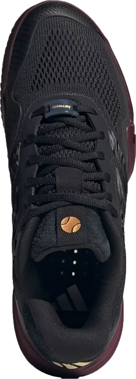Top view of the adidas Barricade 14 Men’s Tennis Shoe in Core Black/Core Black/Maroon, featuring breathable mesh fabric, black laces, a gold logo on the tongue, and a maroon sole—ideal for baseline players seeking stylish performance.