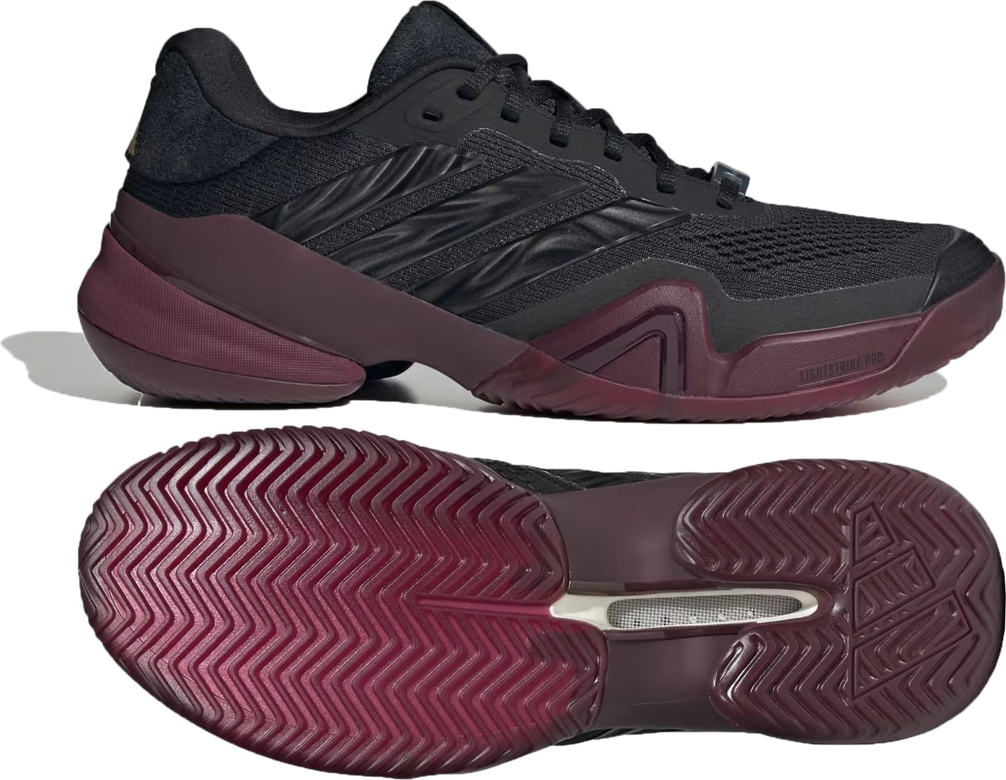 The adidas Barricade 14 Men’s Tennis Shoes in Core Black, Core Black, and Maroon are displayed from a side and sole perspective, emphasizing their textured grip and sleek design features—perfect for baseline players.