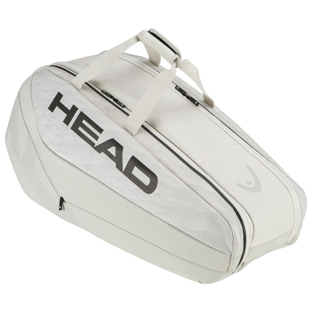 The HEAD Pro X Tennis Racket Bag - M - YUBK is an off-white bag featuring prominent black "HEAD" lettering on the side, drawing inspiration from the SPEED racquet series. It includes two parallel zippers on top and sturdy carrying handles, making it ideal for fans of Novak Djokovic.