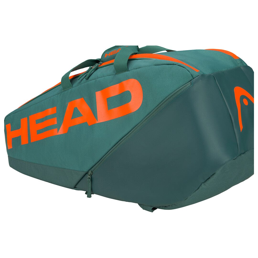 The HEAD Pro Racket Tennis Bag - M - DYFO in green and orange features vibrant orange branding with "HEAD" displayed on the side. Perfect for club players, it includes handles and zippered compartments tailored for transporting racquets and other sports gear.