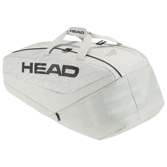 The HEAD Pro X Tennis Racket Bag - L - YUBK (Off White), favored by Novak Djokovic, is a large sports bag featuring a sleek design with the "HEAD" logo in striking black. It comes with sturdy handles, multiple zippered compartments, and advanced climate control technology to maintain your gear in top condition.