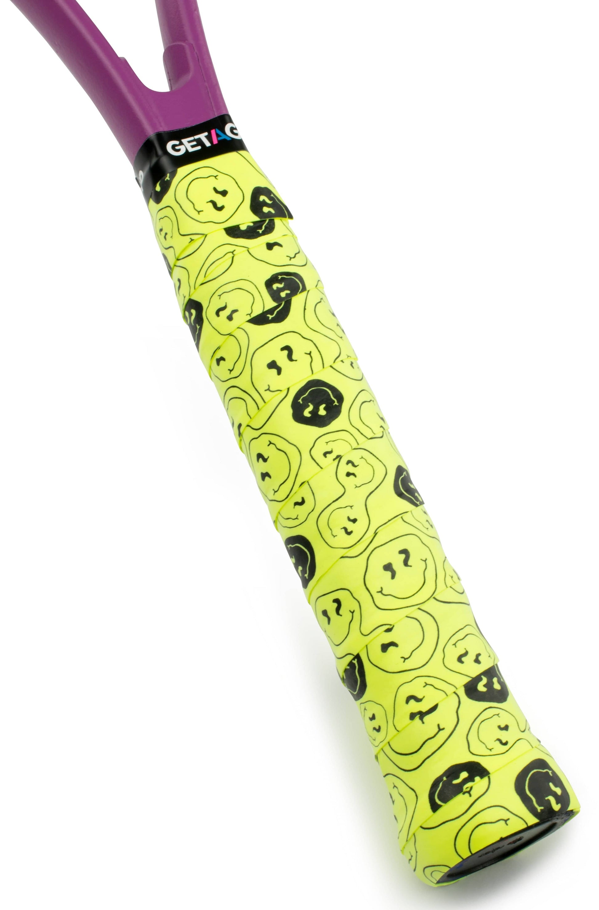 The Get A Grip Tennis Overgrip - Smiley by Get A Grip features a yellow design with black and yellow smiley faces and a "GET A" logo—an ideal, fun tennis gift for any player.