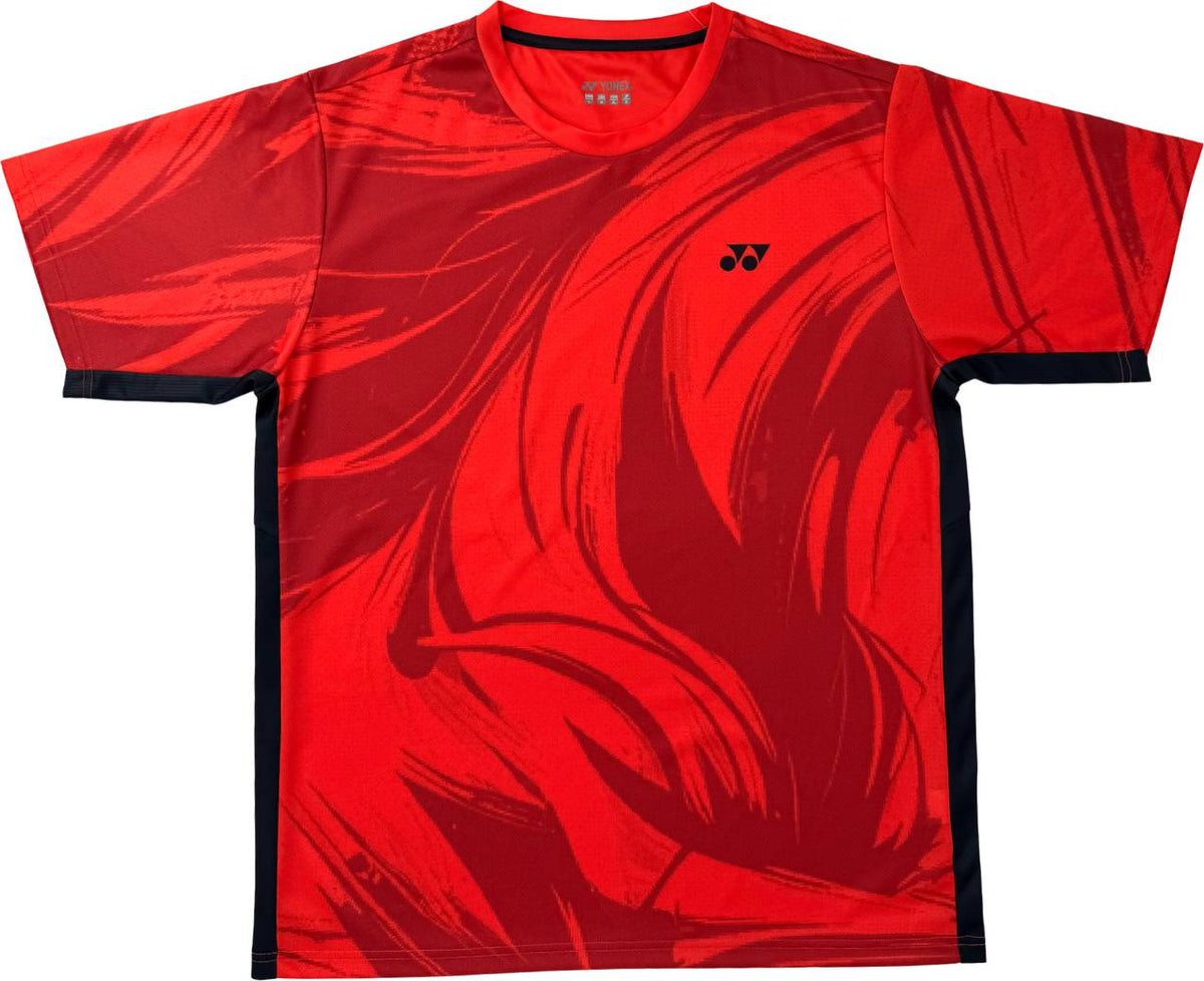 The Yonex YTM14 Mens Tennis T-Shirt in Coral is a vibrant choice for tennis enthusiasts, featuring bold abstract dark red patterns and sleek black side accents. Made from lightweight polyester, this Yonex shirt ensures comfort and breathability on the court. A small black Yonex logo is stylishly placed on the left chest.