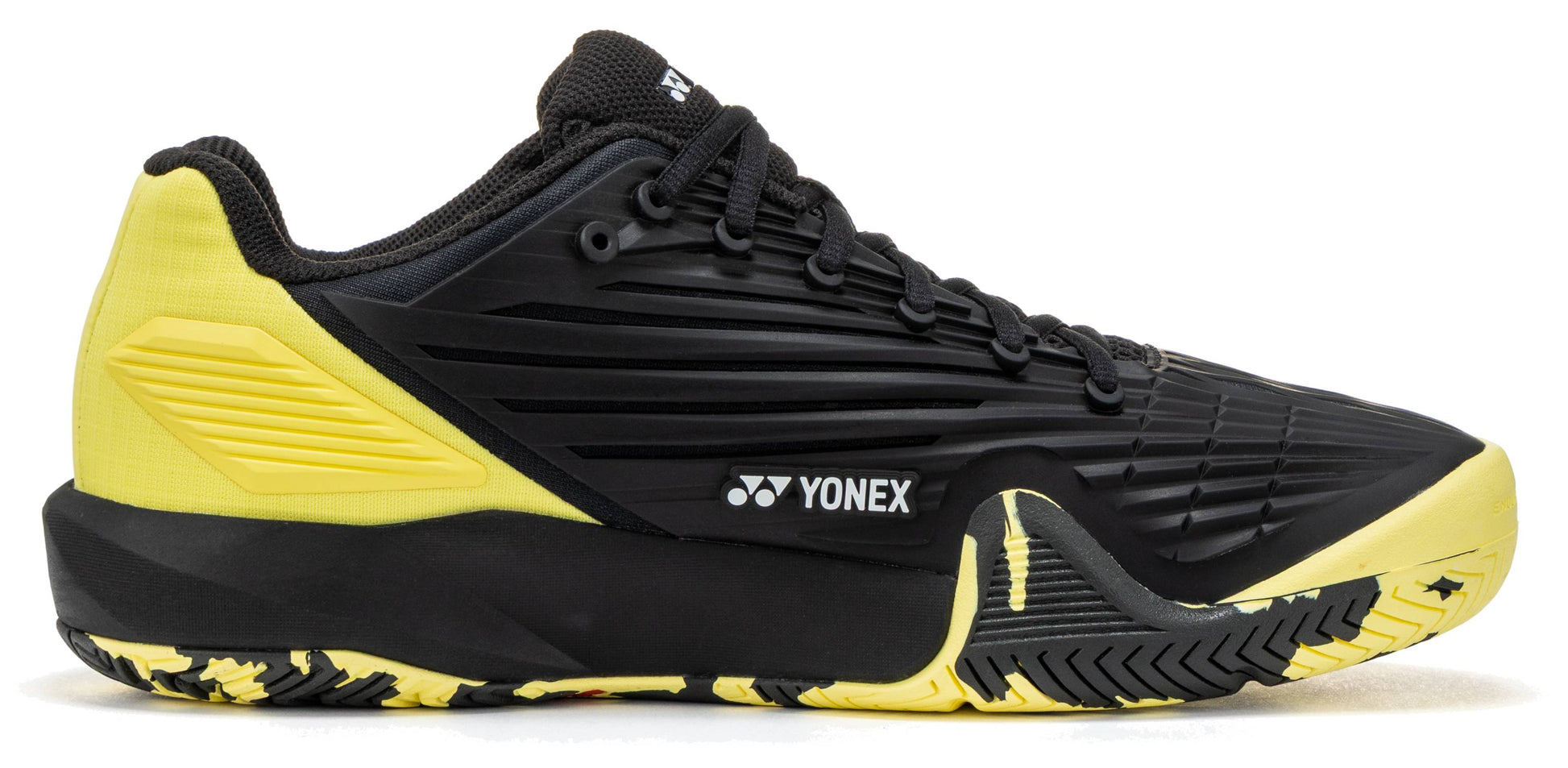 The Yonex Power Cushion Eclipsion 5 Men’s Tennis Shoes deliver top-tier performance with their sleek black upper, eye-catching yellow accents at the heel, and a textured yellow-black sole. Engineered for serious players, these shoes provide outstanding stability on the court. Featuring the signature Yonex logo on the side, black laces, and a low-cut design, they combine style and support in one impressive package for men’s tennis.