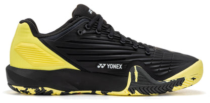 The Yonex Power Cushion Eclipsion 5 Men’s Tennis Shoes deliver top-tier performance with their sleek black upper, eye-catching yellow accents at the heel, and a textured yellow-black sole. Engineered for serious players, these shoes provide outstanding stability on the court. Featuring the signature Yonex logo on the side, black laces, and a low-cut design, they combine style and support in one impressive package for men’s tennis.