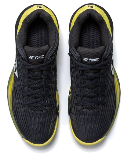 A pair of Yonex Power Cushion Eclipsion 5 Men’s Tennis Shoes in black and yellow, viewed from above. These shoes feature black laces, yellow accents, the Yonex logo on the tongues and sides, and incorporate Yonex’s Power Cushion technology for superior stability on the court.