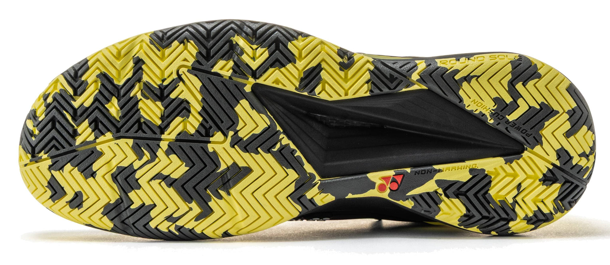 The image displays the black and yellow patterned sole of the Yonex Power Cushion Eclipsion 5 Men’s Tennis Shoes by Yonex, featuring an intricate combination of zigzag and herringbone tread patterns for superior traction. The sole includes text indicating “Round Sole” and “Non-Marking,” emphasizing the shoe’s focus on grip and stability, which are key qualities in high-performance tennis footwear.