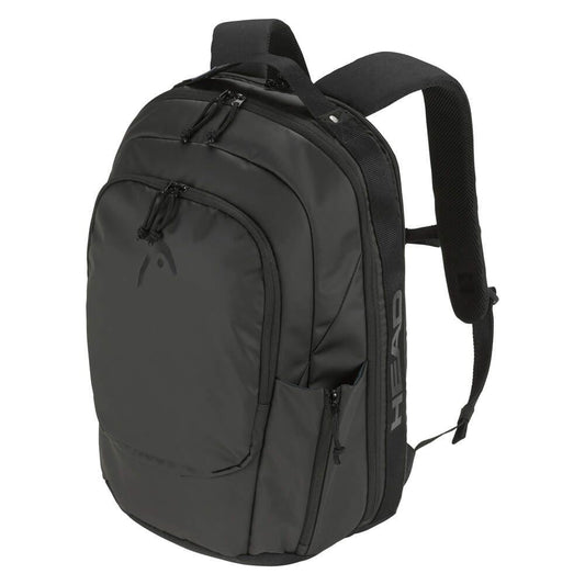 The HEAD Pro X Tennis Backpack - Black by HEAD is designed with multiple compartments and zippers, showcasing an emblem on the front and equipped with adjustable padded straps for comfort. It features a small logo on the side, making it ideal for travel or daily use. Perfect for carrying tennis rackets, this eco-conscious backpack is both functional and stylish.