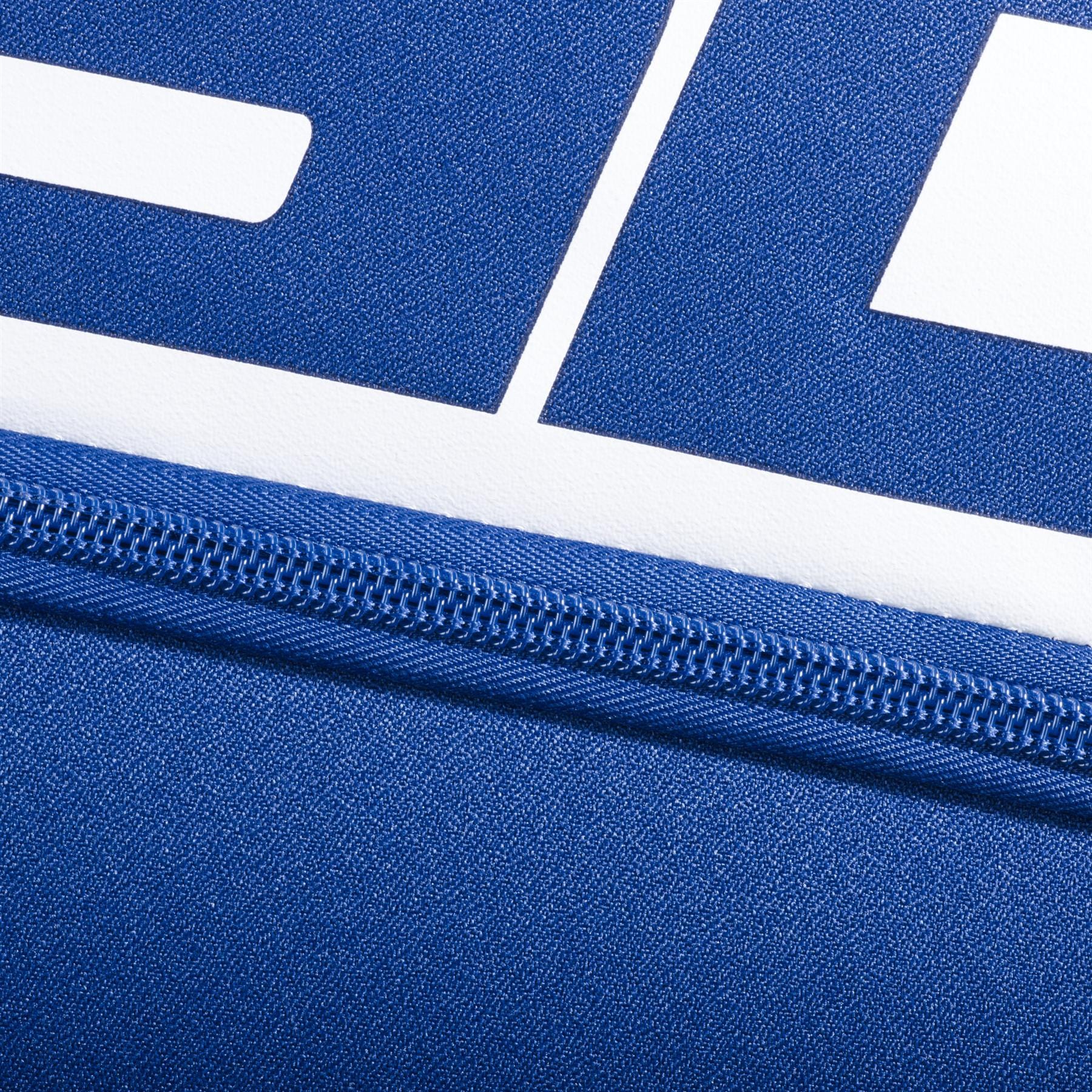 Close-up of the Babolat Court L 9 Racket Tennis Bag - Dark Blue fabric with a zipper and white geometric print, highlighting the texture and stitching details.