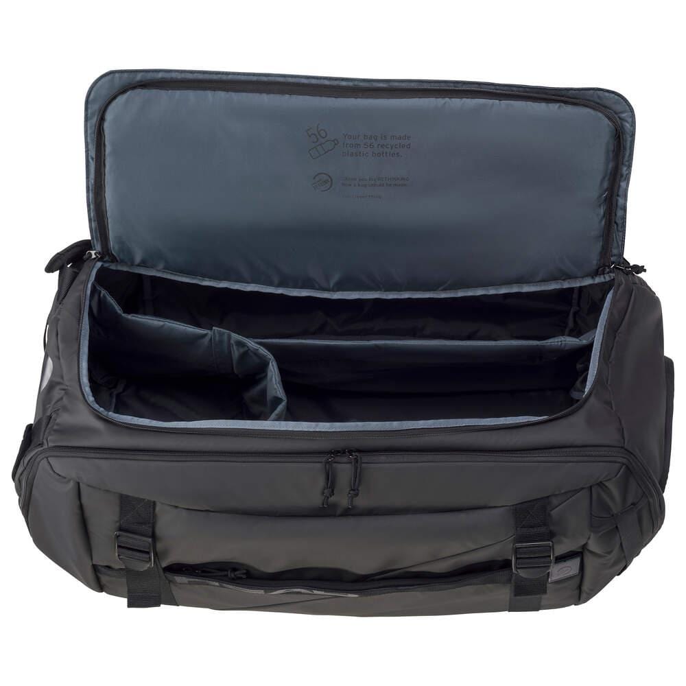 The HEAD Pro X Tennis Duffle Bag XL in black features a spacious main compartment, accessible via the top zipper, divided by adjustable padded dividers. Its interior is gray, and it includes side pockets for extra storage. This eco-conscious bag from HEAD seamlessly merges functionality with sustainability.