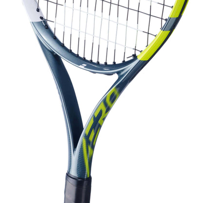 Close-up of the Babolat Aero Junior 26 Tennis Racket 2026 by Babolat, showcasing its blue, yellow, and black graphite composite frame with "AERO" on the side, plus visible strings and part of the handle.