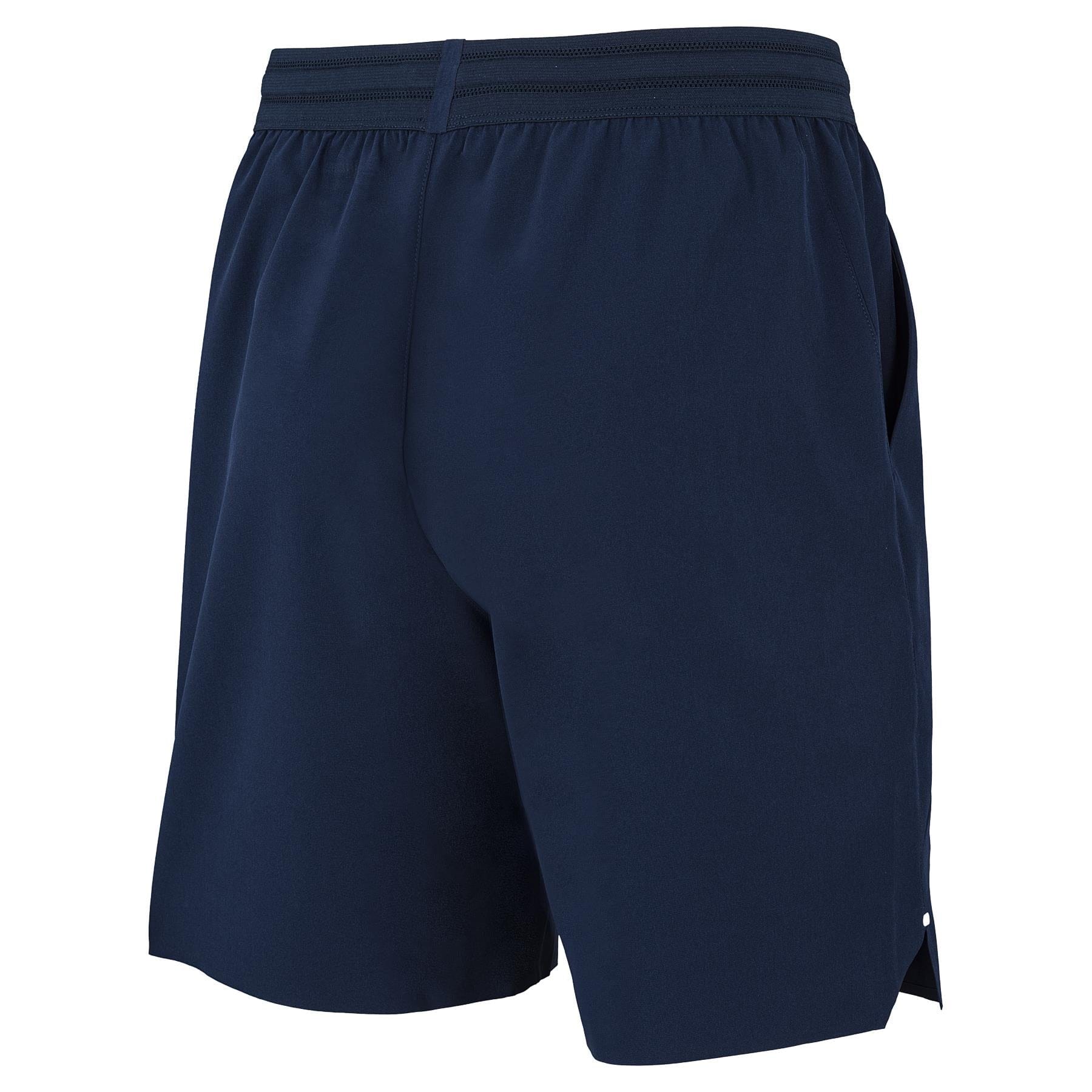 Tecnifibre Team Stretch Men's Tennis Shorts in Marine Blue, featuring an elastic waistband and lightweight, smooth fabric for ideal comfort in sports or casual wear. Shown from the back at an angle on a white background.