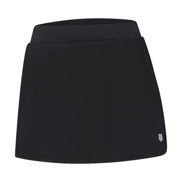 The K-Swiss Tac Hypercourt Pleated Tennis Skirt 4 in black includes a wide waistband, 4-Way Density Stretch technology for enhanced comfort, and a small logo near the bottom hem.