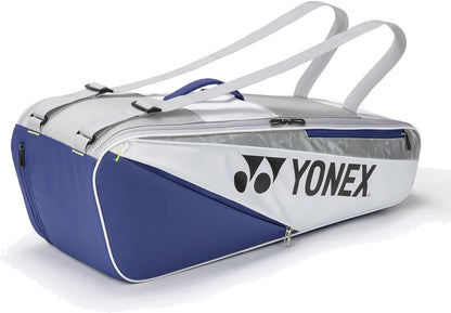 The Yonex BA52526EX Club 6 Racket Tennis Bag in white/blue features two straps, a large side logo, multiple compartments, and a modern design—perfect for carrying all your court essentials.
