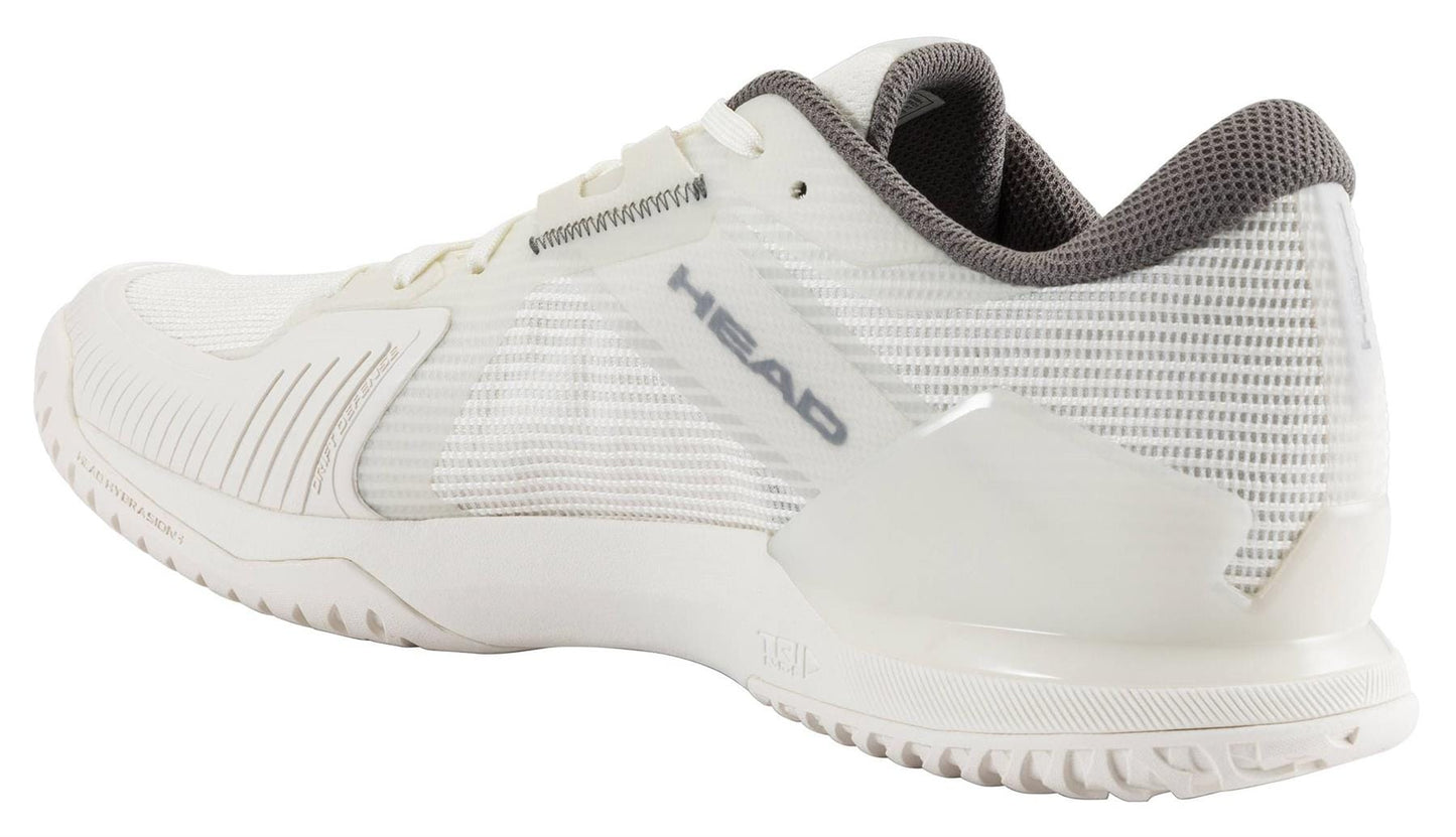 The HEAD Sprint Pro 4.0 Men’s Tennis Shoes in Chalk White/Dark Grey feature a mesh upper and textured rubber sole. Shown at an angle, these lightweight HEAD sneakers highlight the heel and outer side for a sporty look.