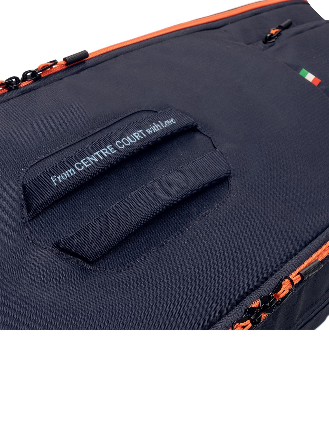 Close-up of the HEAD Pro 9 Racket Tennis Bag L in navy by HEAD, featuring orange zippers, a handle with "From CENTRE COURT with Love" text nearby, and a small Italian flag in the upper right corner.