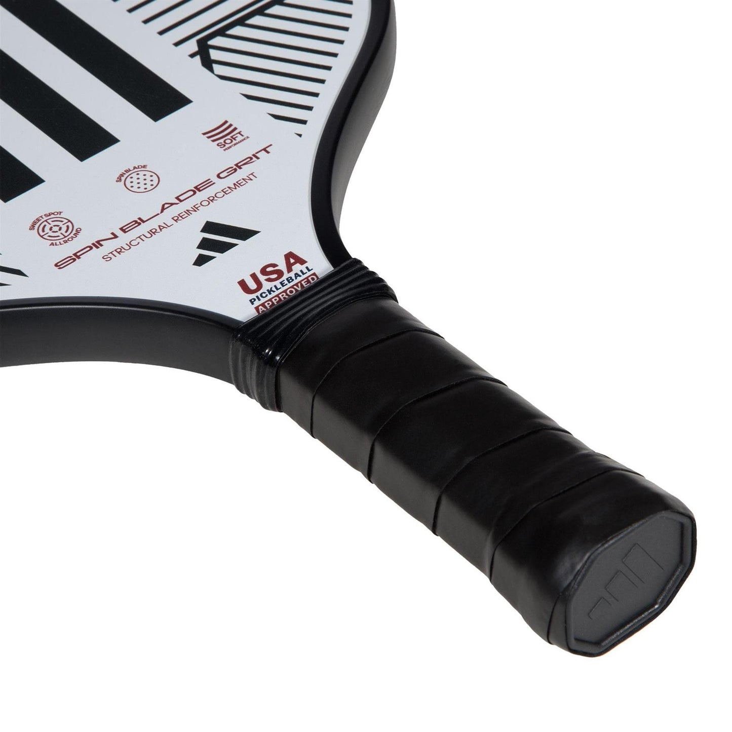 Close-up of the ADIDAS Match Light 3.3 Pickleball Paddle by adidas, featuring a black grip, white and black patterned face with "USA" and "Spin Blade Grit" text—ideal for beginners seeking enhanced control.