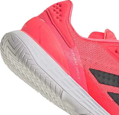 Close-up of the heel and sole of a bright coral adidas Defiant Speed 2 Mens Tennis Shoes - Solar Turbo / Core Black / Cloud White, featuring a textured white Ubersonic outsole and a black logo on the side.