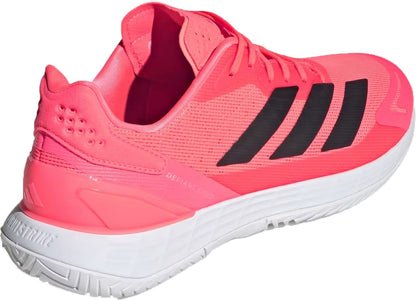 Bright pink adidas Defiant Speed 2 Mens Tennis Shoes - Solar Turbo / Core Black / Cloud White featuring three black stripes on the side and a white Ubersonic outsole.