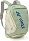 The Yonex 02612EX Expert Tennis Backpack in Smoke Green features padded shoulder straps, multiple zippered compartments, and a blue Yonex logo—combining style and function for tennis players.