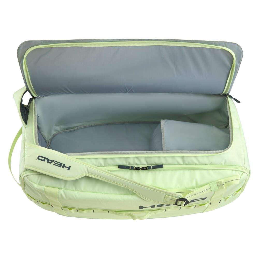 Introducing the HEAD Pro Duffle Tennis Bag M - LLAN: a lime green duffle bag featuring a roomy interior with sleek gray lining. It includes a small internal compartment ideal for accessories. Part of the EXTREME racket series, this bag displays "Head" on the strap, perfectly aligning with its design ethos.