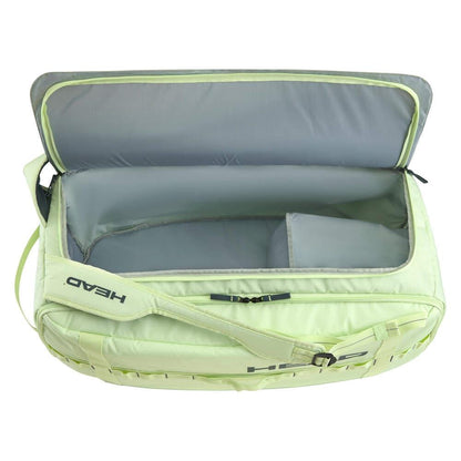 Introducing the HEAD Pro Duffle Tennis Bag M - LLAN: a lime green duffle bag featuring a roomy interior with sleek gray lining. It includes a small internal compartment ideal for accessories. Part of the EXTREME racket series, this bag displays "Head" on the strap, perfectly aligning with its design ethos.