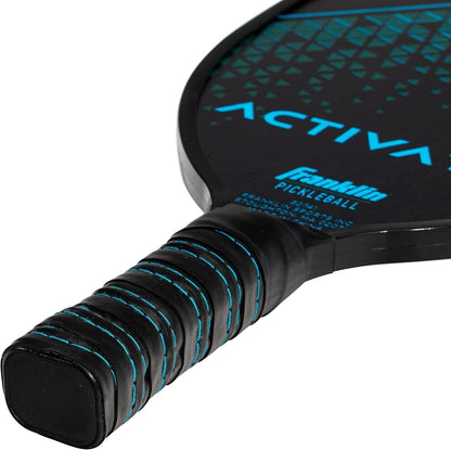 Close-up of the handle and part of the face of a black Franklin Activator pickleball paddle with blue accents and textured grip. The word "Activator" is partially visible on this USA Pickleball Approved paddle from Franklin.