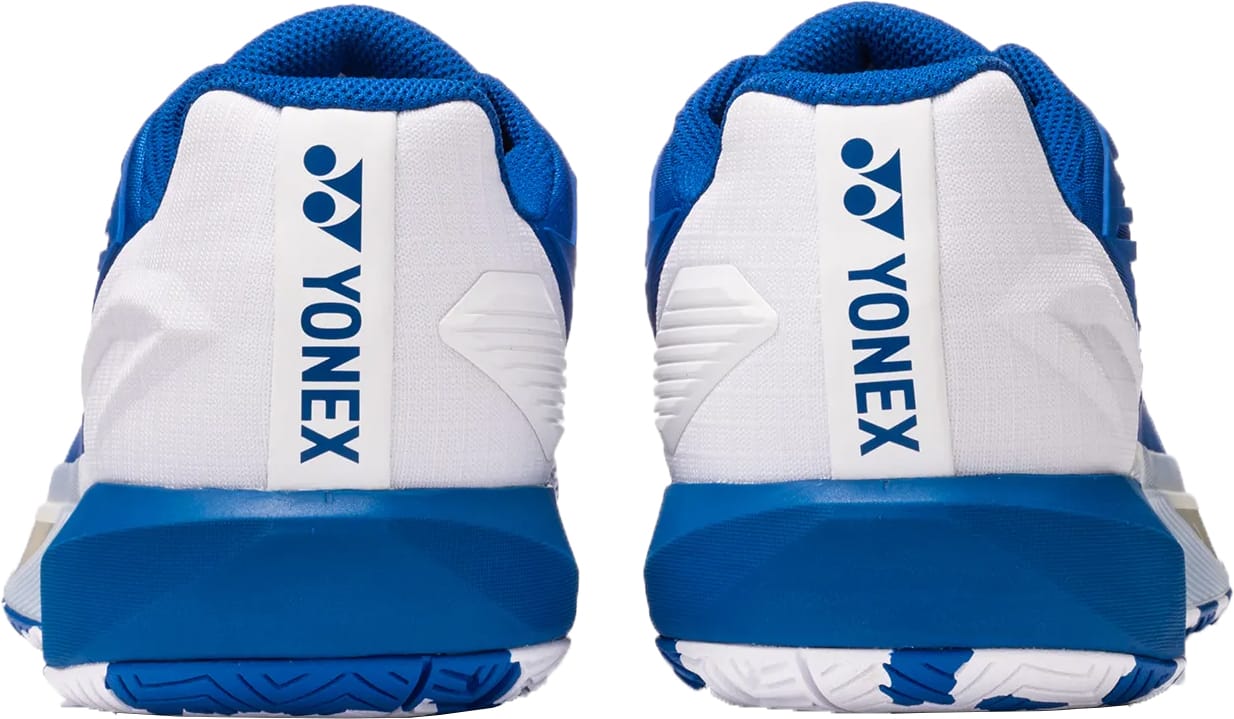 Rear view of Yonex Power Cushion Eclipsion 5 Mens Tennis Shoes in blue and white, featuring the Yonex logo and vertical brand name on the heels.