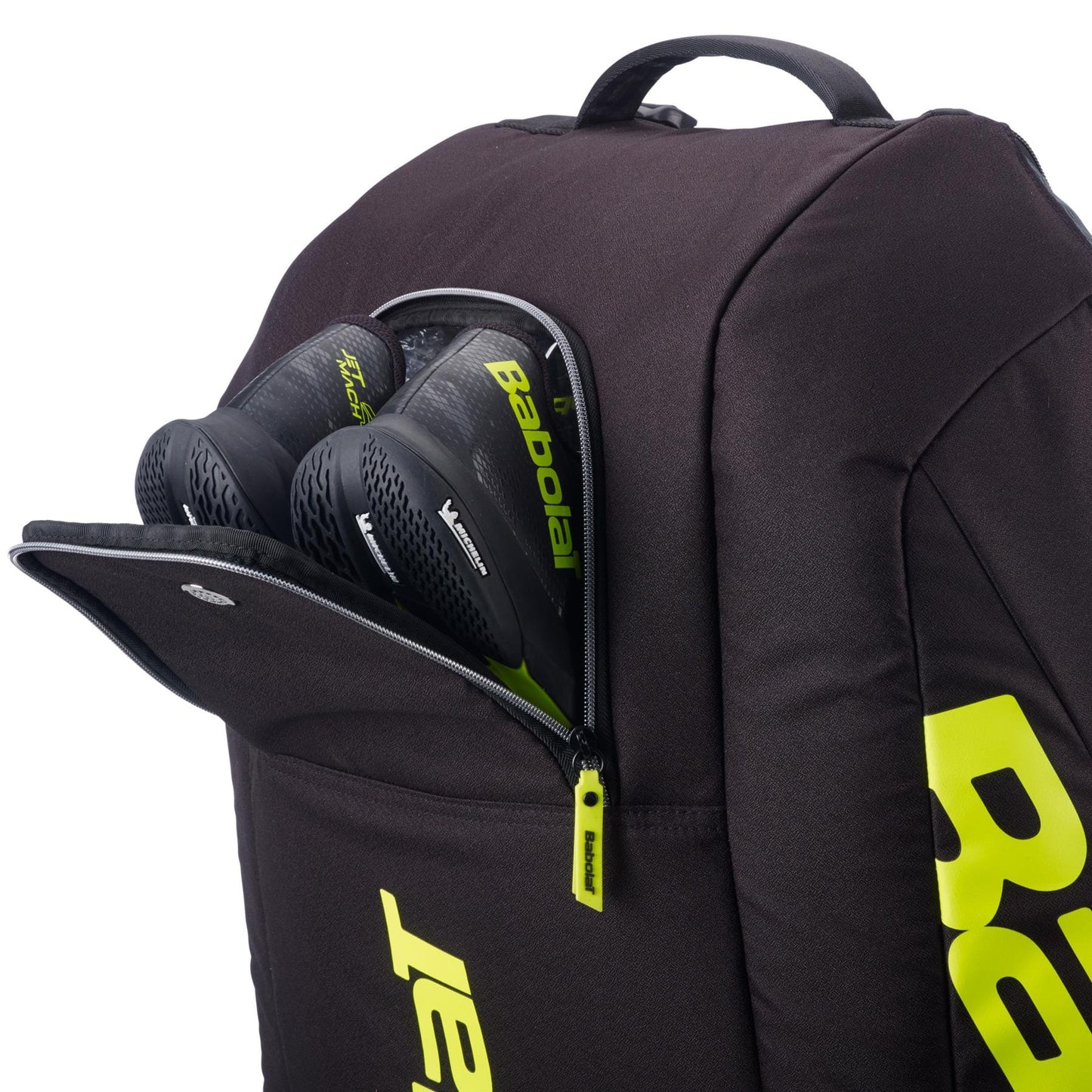 A Babolat RH12 Pure Aero 12 Racket Tennis Bag in grey and yellow is shown with a partially open zippered compartment, revealing two matching tennis racket handles inside.