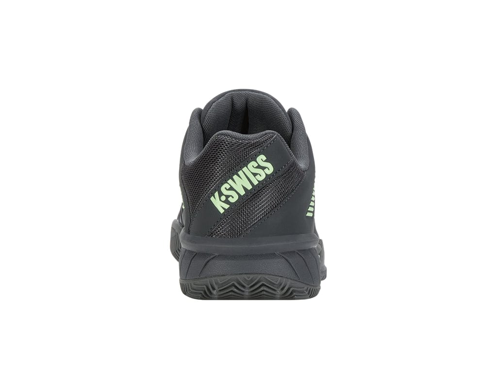 A K-Swiss Express Light 3 HB men's tennis shoe is shown from the back, with the brand name visible in soft neon green text on the heel. Designed for top-tier performance on clay court surfaces, it features a textured sole and a padded collar for enhanced comfort. The color scheme includes sea spray, urban chic, and soft neon green accents.