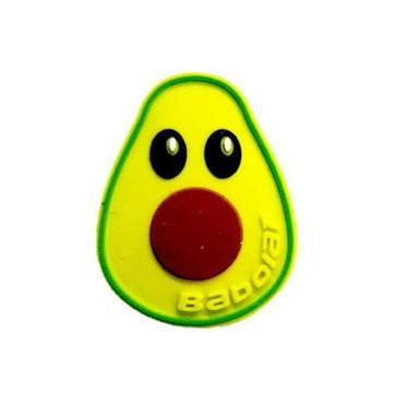 The Babolat Loony Damp Tennis Dampener - Avocado features a cute cartoon avocado with big black eyes and a red pit, outlined in green, for effective vibration reduction on your tennis racquet.