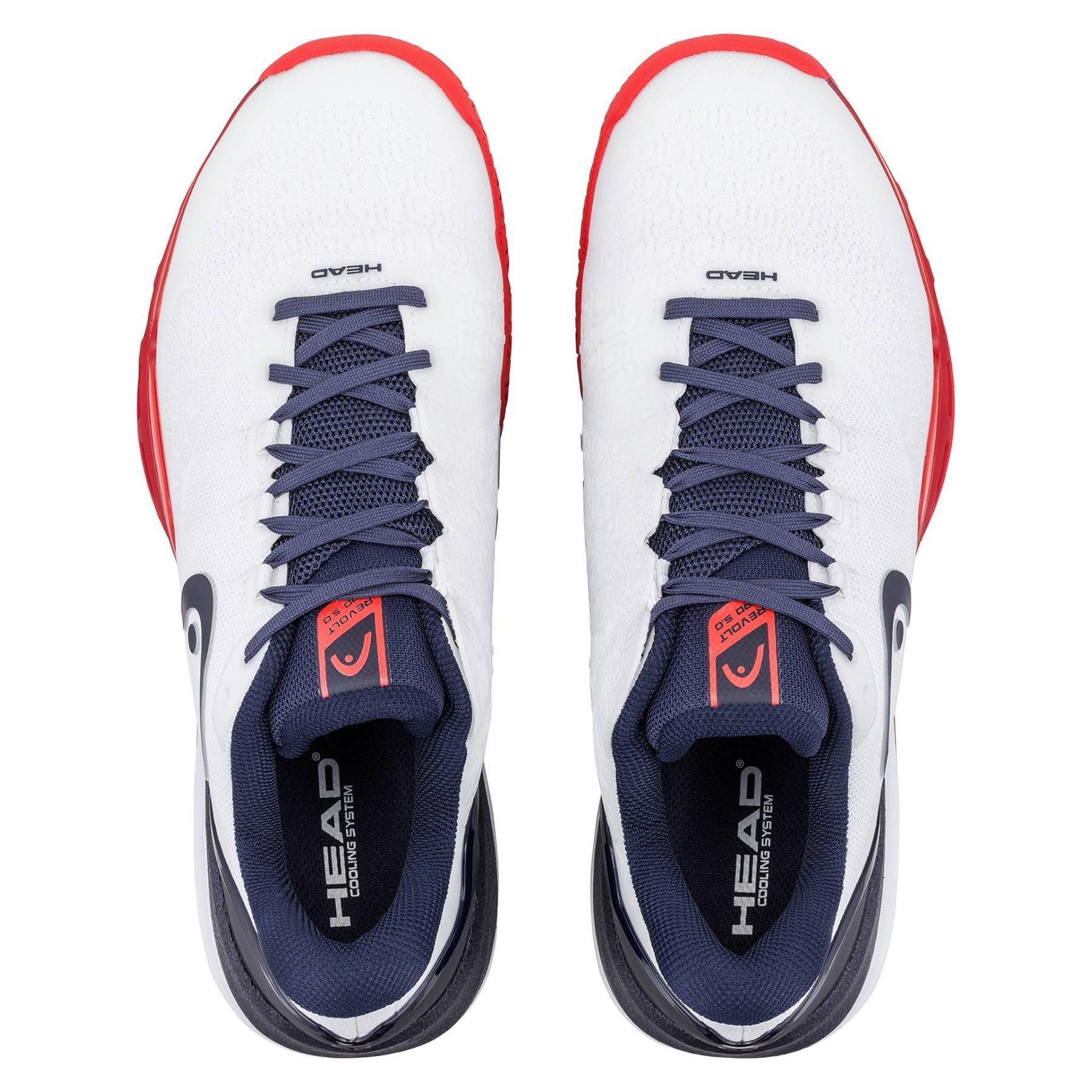 A pair of HEAD Revolt Pro 5.0 Mens Tennis Shoes in White/Navy, featuring navy laces, navy and black interior, red-accented soles. "HEAD" appears on the tongue and insole—ideal for baseline players.