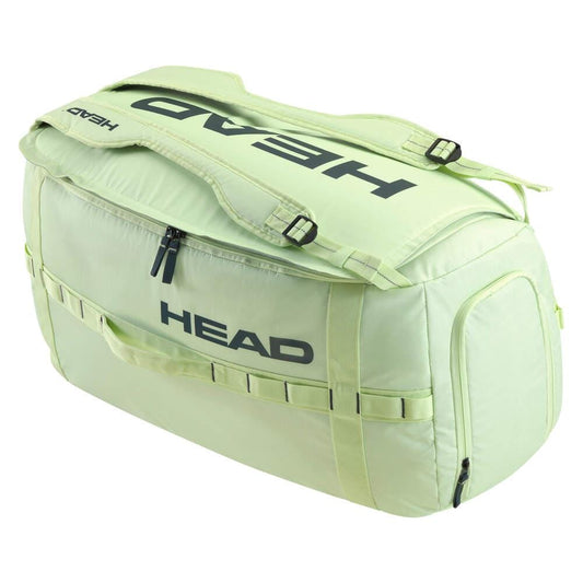 The HEAD Pro Duffle Tennis Bag M - LLAN in light green, highlighted with black "HEAD" logos, is perfect for transporting sports or travel items. It offers a large main compartment, a zippered side pocket, and adjustable shoulder straps, making it an excellent match for the EXTREME racket series.
