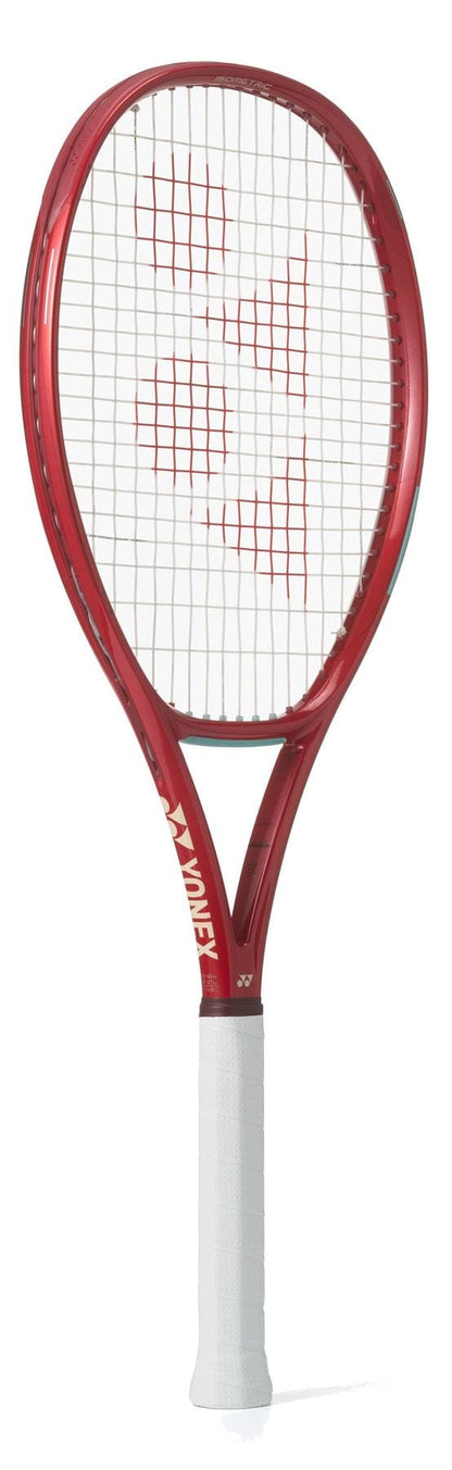 The Yonex VCORE 100D Ruby Red 2026 Tennis Racket, featuring a white grip and white string bed with a red center pattern, is celebrated for its spin potential and shown here on a white background.