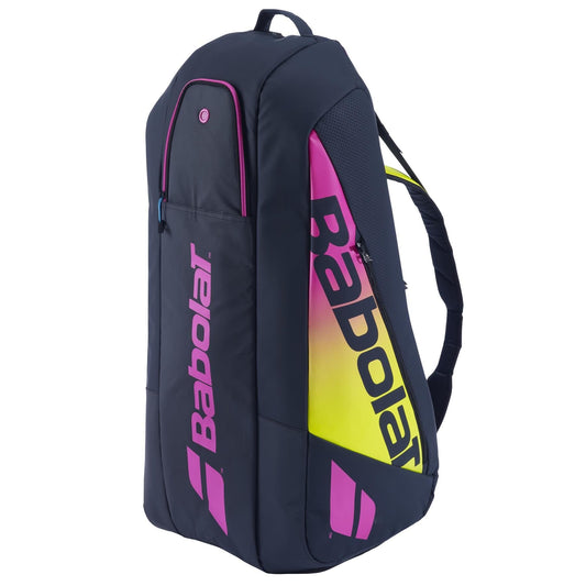 The Babolat RH6 Pure Aero Rafa II tennis bag by Babolat features a stylish blue exterior with bold pink and yellow accents on the logo. Tailored for advanced players, it includes multiple compartments, as well as a top handle and comfortable shoulder straps for easy transport.