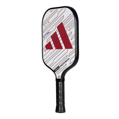The adidas ADIDAS RX CTRL 3.3 Pickleball Paddle in white features a geometric design, red logo, black edge guard and textured handle, plus Spin Blade Grit surface and HD Polypropylene Honeycomb Core for top performance.