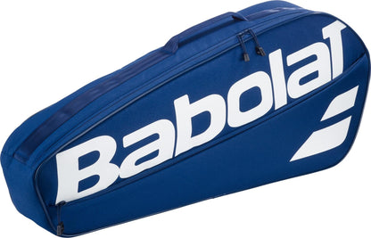 The Babolat Court XS 3 Racket Tennis Bag - Blue features a large white Babolat logo and zipper, offering a compact design to carry rackets and gear.