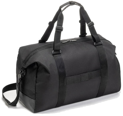 The Yonex BA72611EX Gearlogic Tennis Boston Bag in black features a zippered main compartment, two short handles, and an adjustable shoulder strap. The bag appears plain with no visible logo or design.