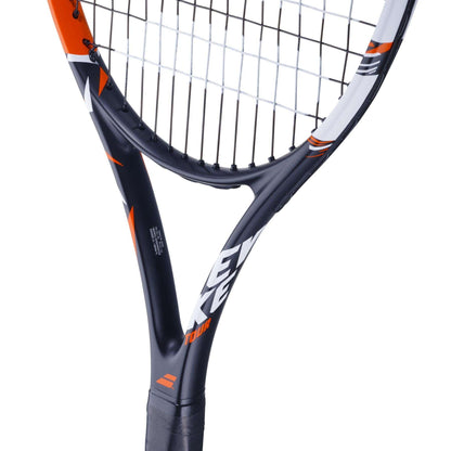 Close-up of a Babolat Evoke Tour Tennis Racket in black and red, showcasing text printed on the frame. The strings are visible, and part of the handle is shown—ideally crafted for beginners seeking precision and style.