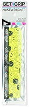 A pack of Get A Grip Tennis Overgrip - Smiley features a bright yellow grip with black cartoon faces, branded with "Get A Grip" and the slogan "MAKE A RACKET"—a fun tennis gift for any player.