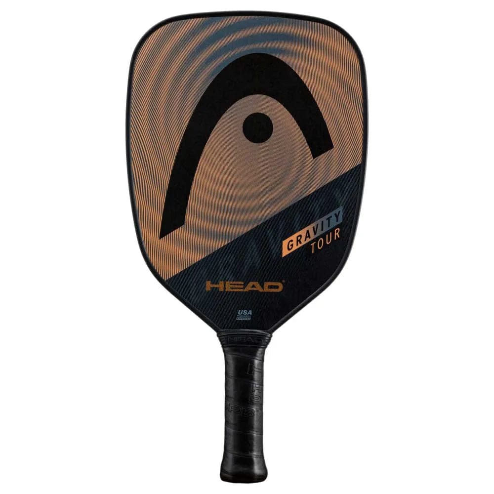 The HEAD Gravity Tour 2023 Pickleball Paddle in Black/Bronze features a large black HEAD logo on a brown and black face, SpinOn technology, "GRAVITY TOUR" text near the base, and a black handle.