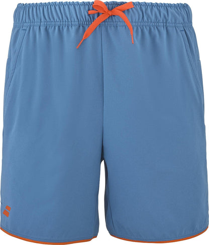 The Babolat Perf Men's Tennis Shorts in Seaport blue feature an orange waistband drawstring, orange-trimmed leg openings, side pockets, and a small orange logo near the bottom left hem.