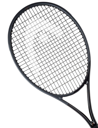 Close-up image of the HEAD Speed Pro LTD 2023 Tennis Racket - Black (Frame Only) highlighting its Auxetic construction. With tightly strung strings and a partially visible handle, this tennis racket displays its Graphene Inside technology against a plain white background.