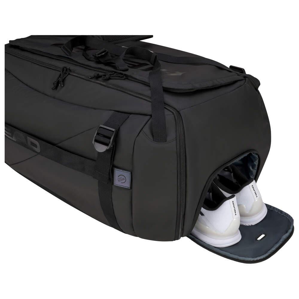 The HEAD Pro X Tennis Duffle Bag XL in black has a side compartment slightly open, displaying a pair of white athletic shoes inside. This eco-friendly bag, designed by HEAD, boasts multiple zippers and handles for easy use, seamlessly combining style and sustainability for the contemporary athlete.