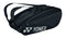 Introducing the Yonex 42329EX Team 9 Racket Tennis Bag - Black, a stylish and versatile carrier with two shoulder straps and a prominent Yonex logo on the side. This sleek bag includes multiple zippered compartments, featuring a dedicated shoe compartment for optimal organization of your gear.