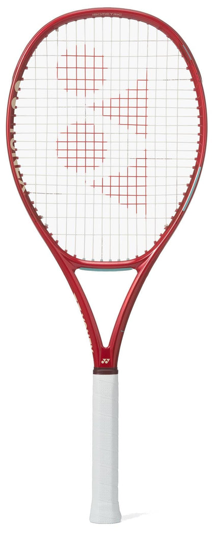 The Yonex VCORE 100D Ruby Red 2026 Tennis Racket, featuring a white grip and strings with a red logo pattern, is displayed against a white background, emphasizing its impressive spin potential.