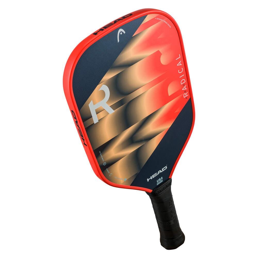 The HEAD Radical Pro Pickleball Paddle in orange and navy features a durable Composite Hitting Surface, a textured black handle for superior grip, and signature "R" gradient graphics. Brand: HEAD.