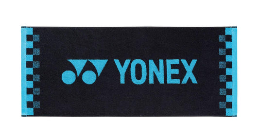 The Yonex AC1109EX Face Towel in black is made from premium cotton and showcases the brand logo and name in blue, complemented by a chic blue checkered pattern along the edges. Ideal for gym sessions and sports enthusiasts who value quality and style.